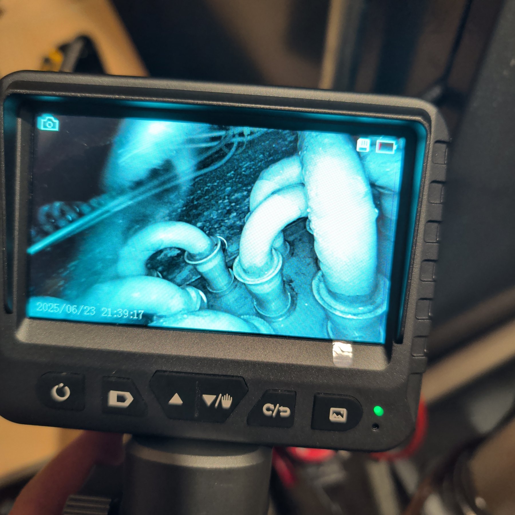 Borescope screen showing the inside of ductwork during an HVAC and indoor air quality inspection
