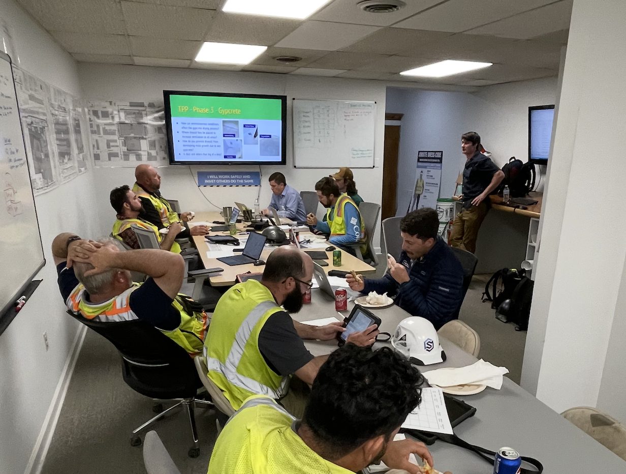 Prescient Environmental leading a mold awareness training for a construction team