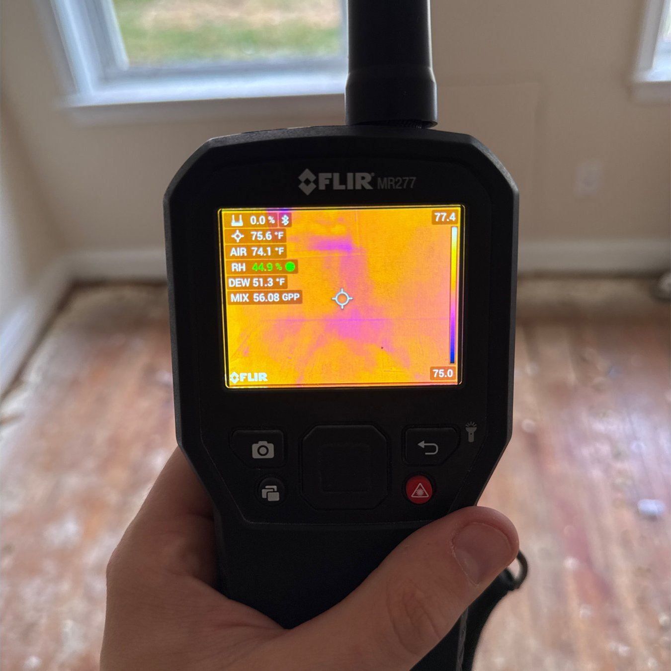 FLIR MR277 thermal image of a window wall showing a cool wet area during a moisture and envelope inspection